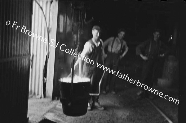 IN THE FOUNDRY POURING MOLTEN METAL INTO MOULDS